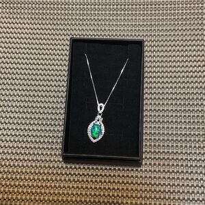Radiant Silver Necklace with Green Gemstone Pendant
